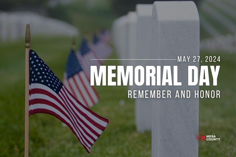 American flags lined up next to white headstones and white text reading "MAY 27, 2024 MEMORIAL DAY REMEMBER AND HONOR," with the Mesa County logo on the bottom right. 