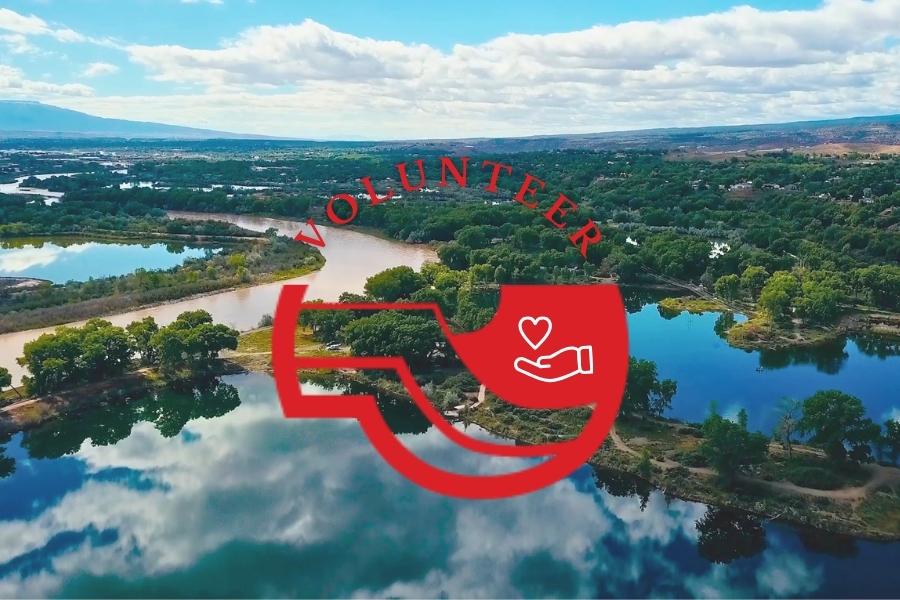 Aerial view of bodies of water in Mesa County, CO with red Mesa County logo reading, "volunteer" above it. 
