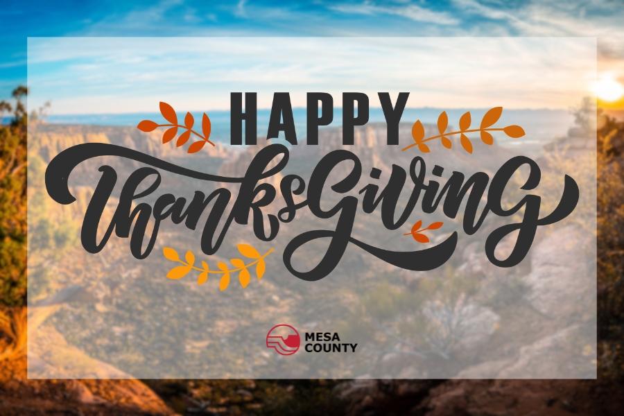 Blurry National Monument with "Happy Thanksgiving" element and the Mesa County logo.