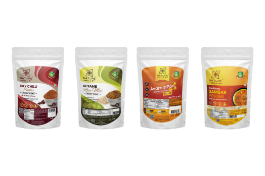 white packages of organic dry chilli powder, sesame rice mix, avarampoo soup, and traditional sambar powder