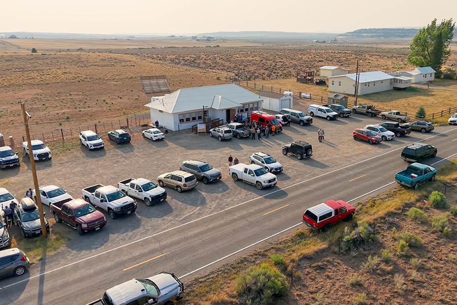Aerial view of the Glade Park community center with people and cars in the parking lot.