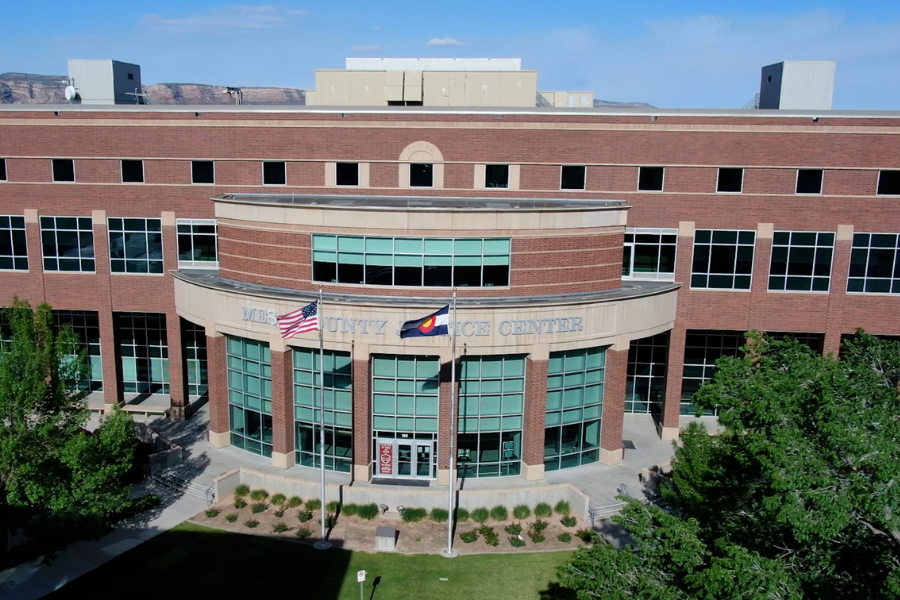 Drone photo of the Mesa County Justice Center with rooftop heating and cooling units visible on top of the building. 